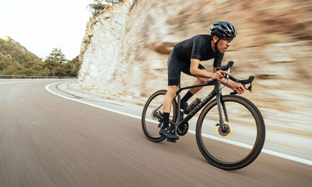 Cyclist riding a Road Bike down hill